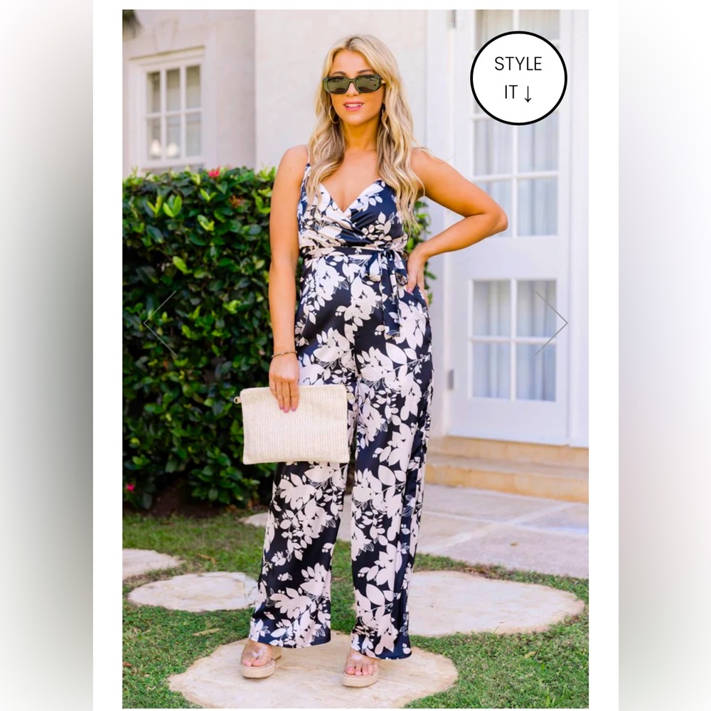 NEW with tags- Gorgeous black floral jumpsuit (Size Small)